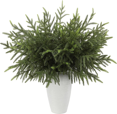 Faux Norfolk pine stems in a white vase