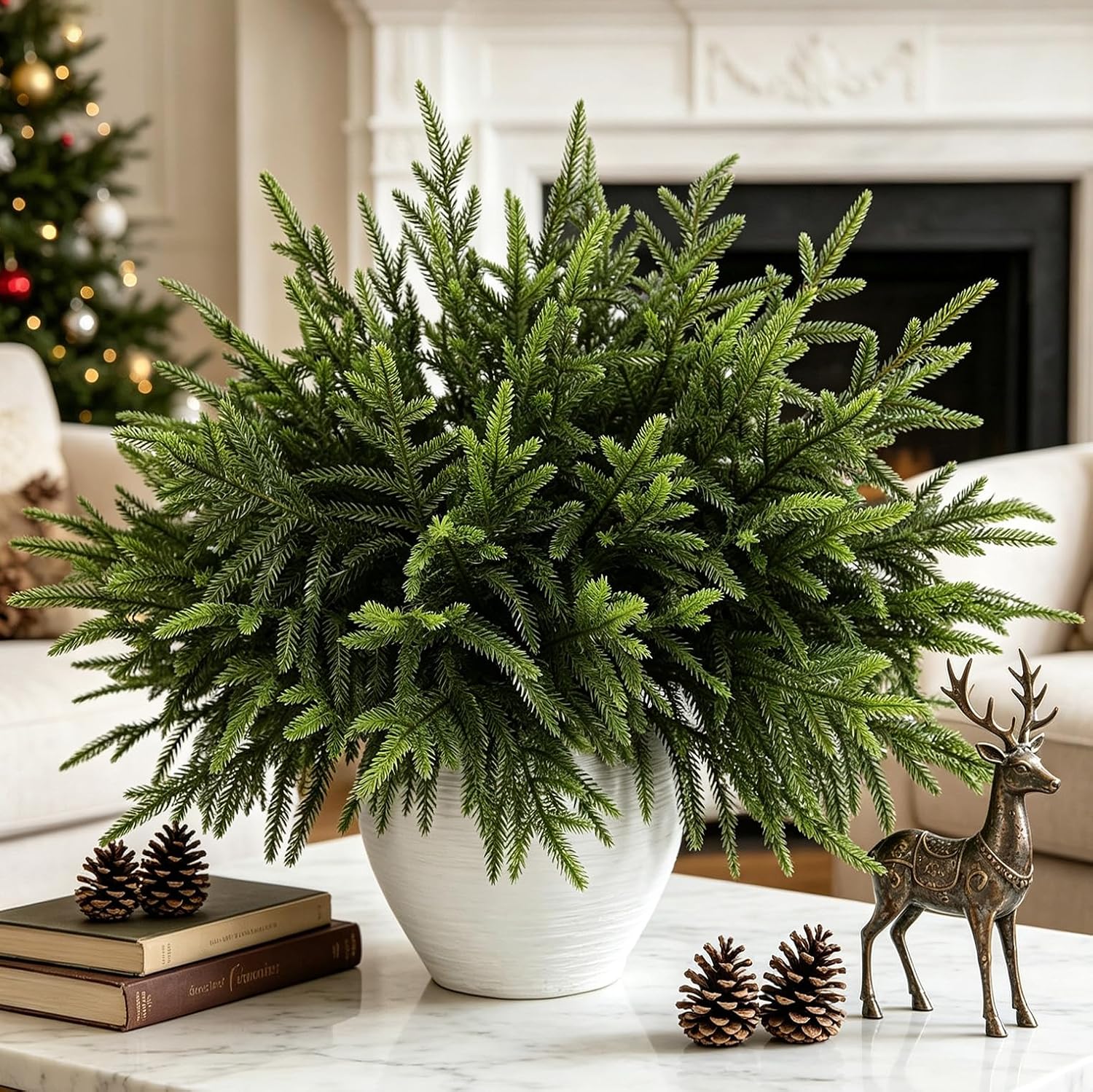Full Norfolk pine stems in a white vase on a coffee table